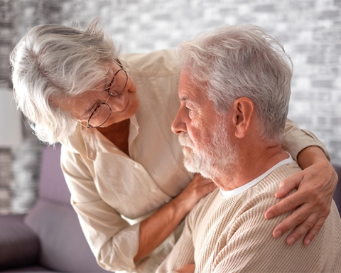 elderly wife consoling husband