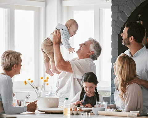 Family members gathered around a table eating