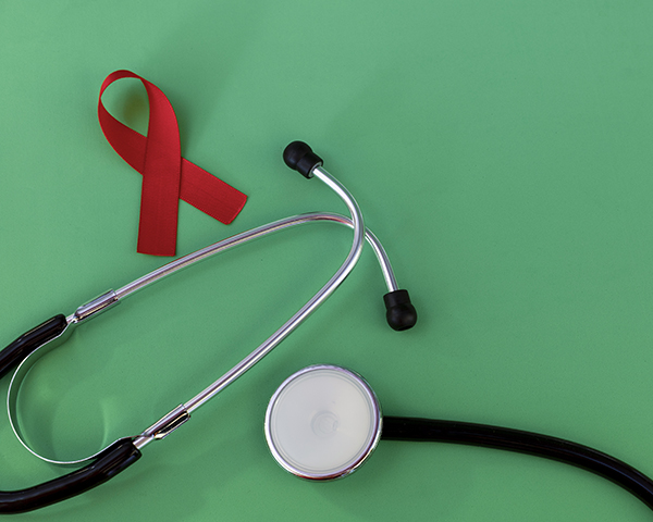 HIV red ribbon and stethoscope